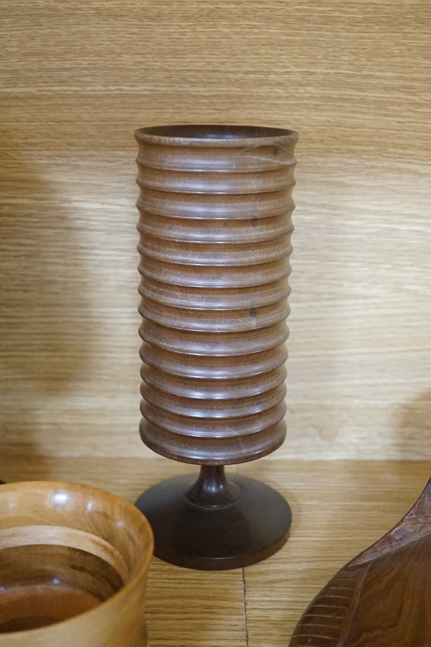 A quantity of African and other carvings including an ostrich egg